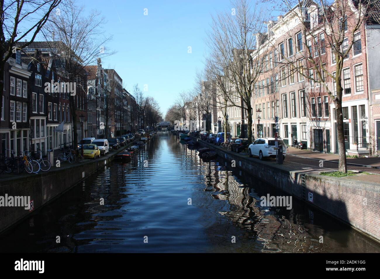 the canals of the rivers of Amsterdam and the buildings on the street ...