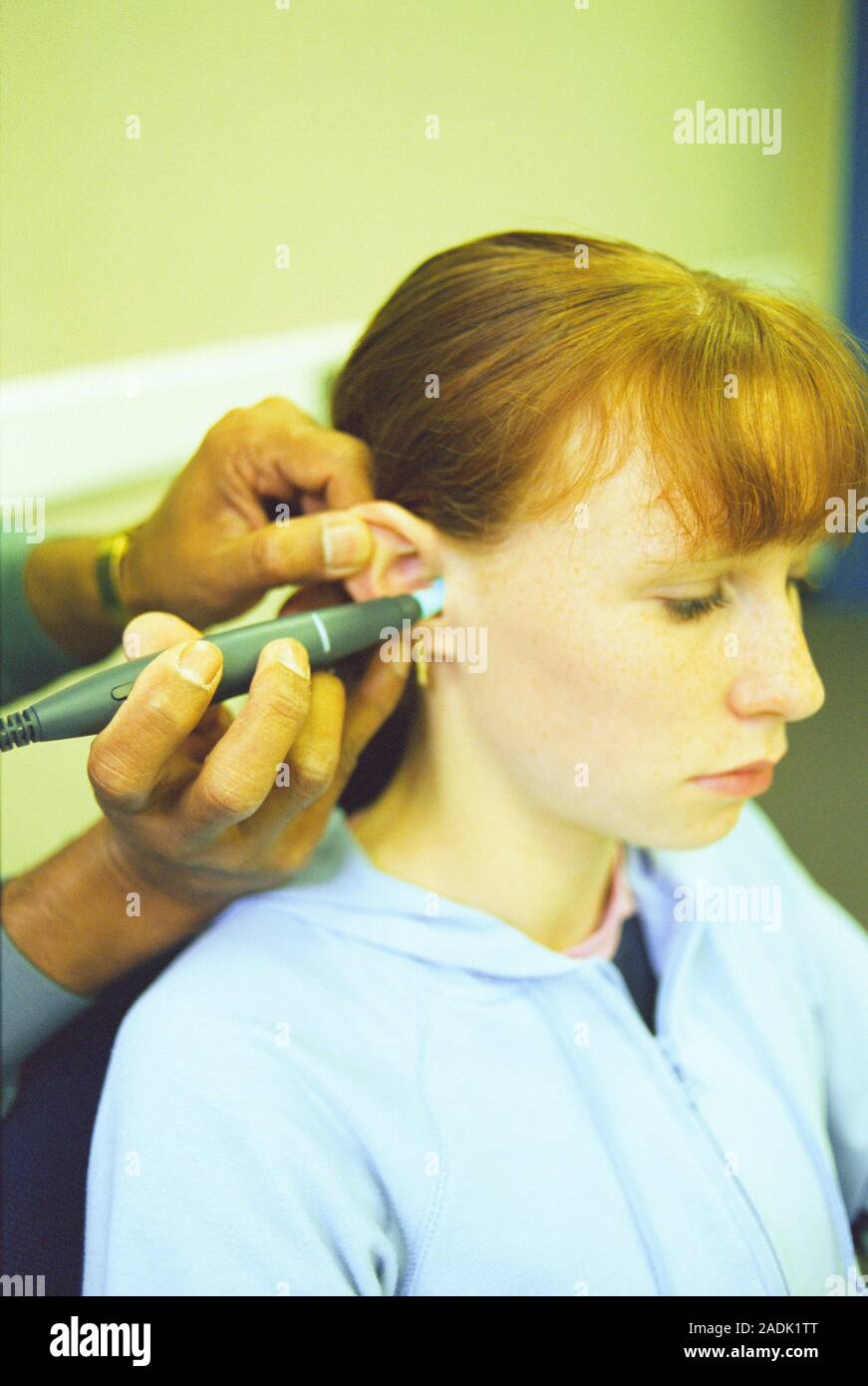 Tympanometry examination. Teenage girl having tympanometry to measure
