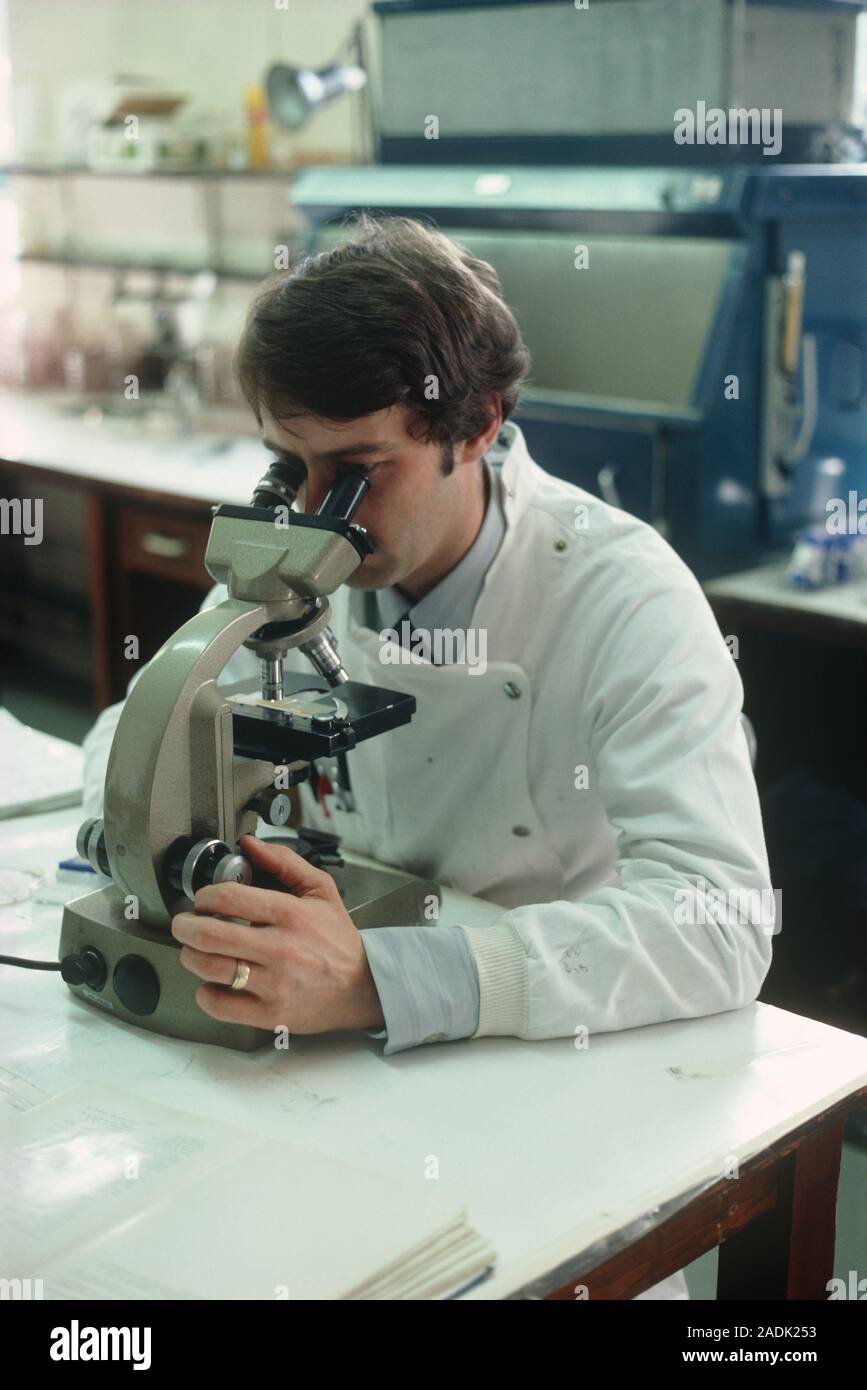 Leeds Public Health Laboratory Service showing researcher using a light