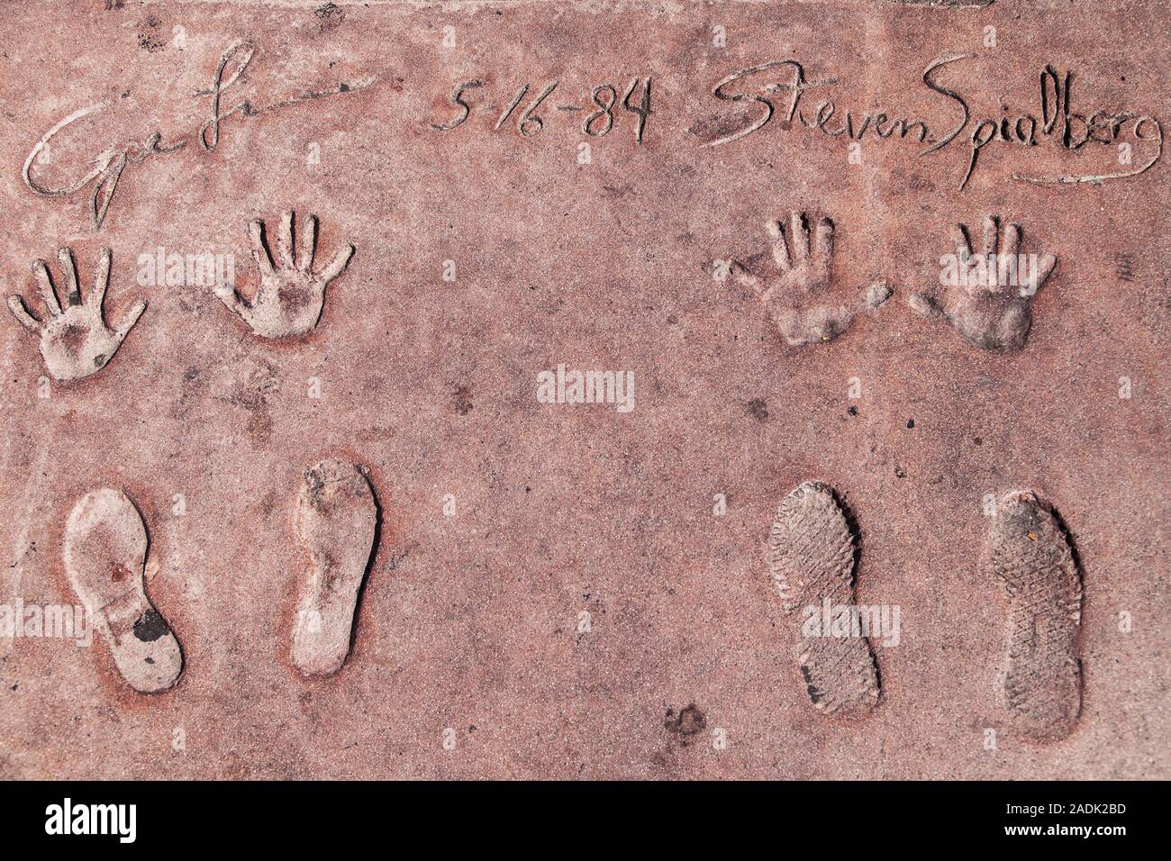 Los Angeles, California - September 07, 2019: Hand and footprints of filmmakers George Lucas and Steven Spielberg in the Grauman's Chinese Theatre. Stock Photo