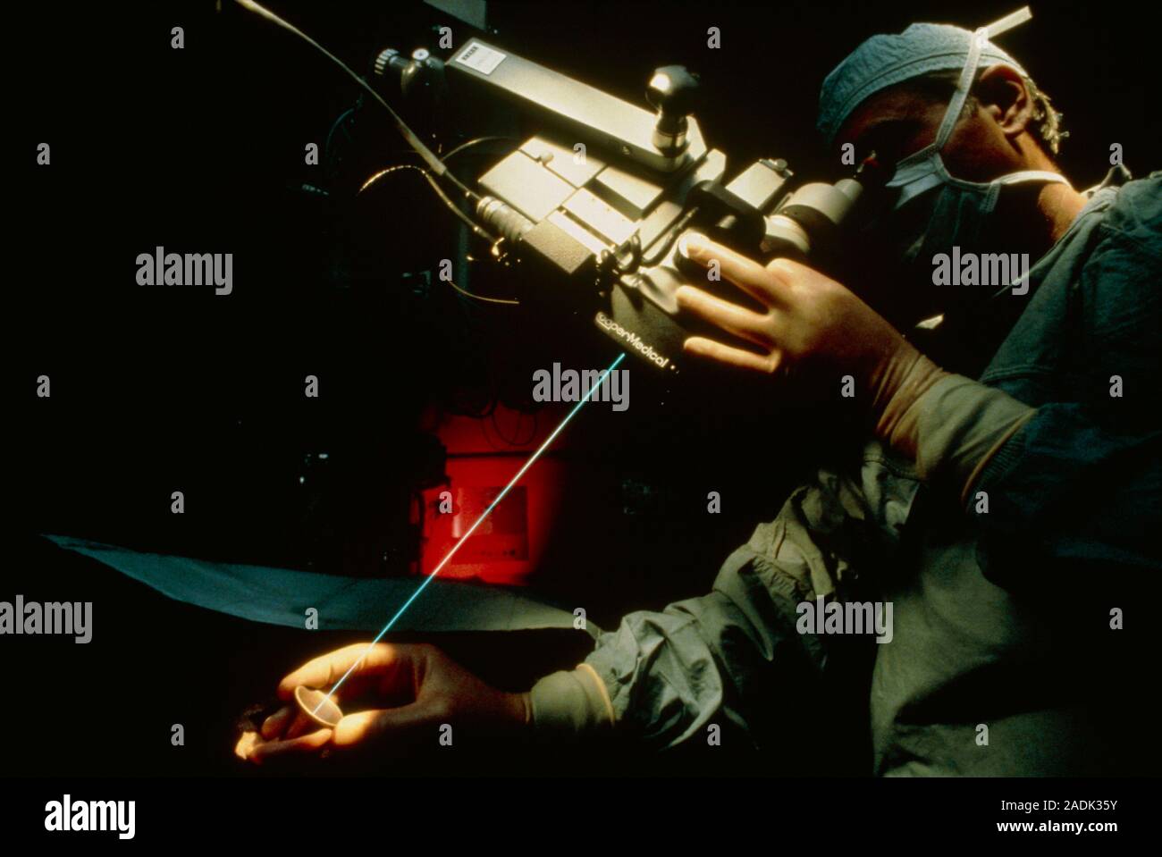 Surgeon using the blue beam of an argon laser to operate deep within
