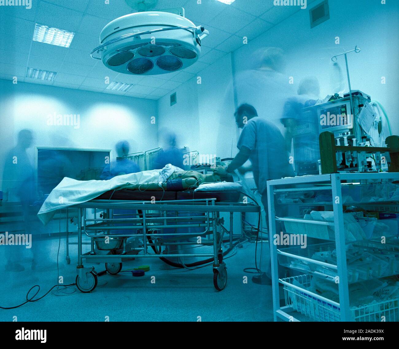 Medical training dummy being treated in a mock operating theatre. This