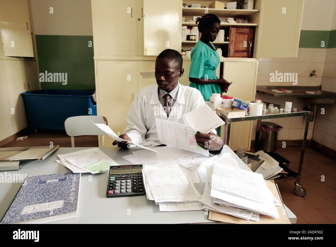 MODEL RELEASED. Hospital administration. Hospital staff carrying out ...