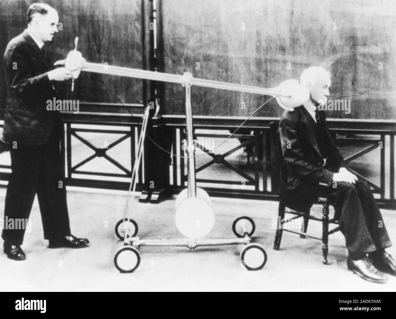 Radium therapy. Man with neck cancer receiving radiotherapy treatment