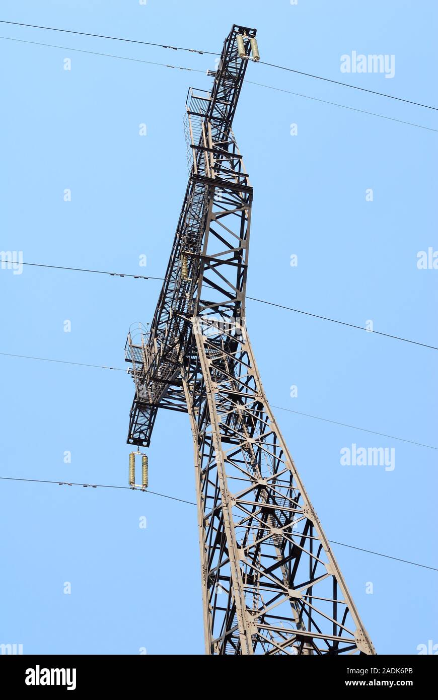 High voltage Electricity pylon against blue sky Stock Photo - Alamy
