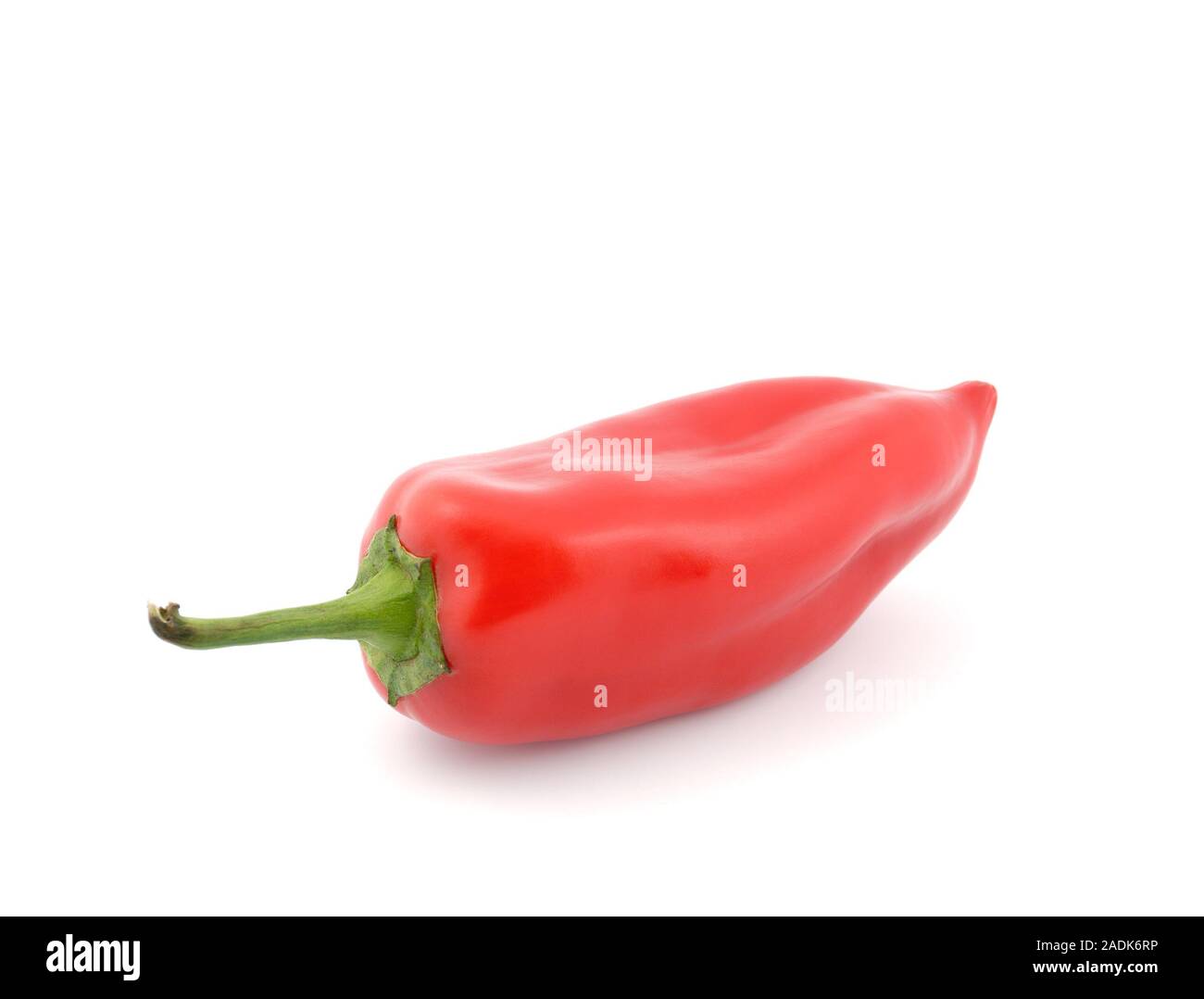 Red sweet peppers on a white background Stock Photo - Alamy