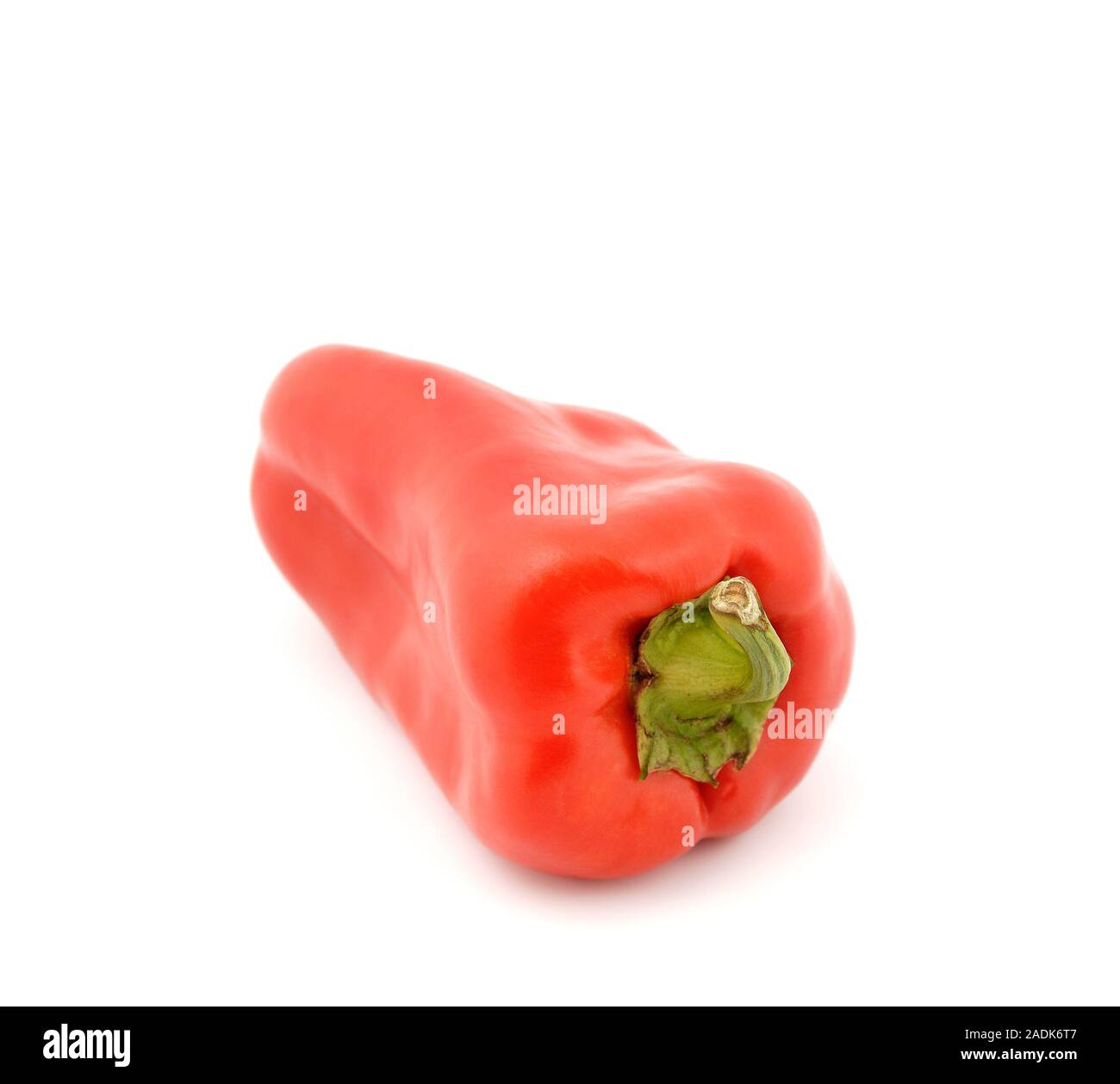 Red sweet peppers on a white background Stock Photo - Alamy
