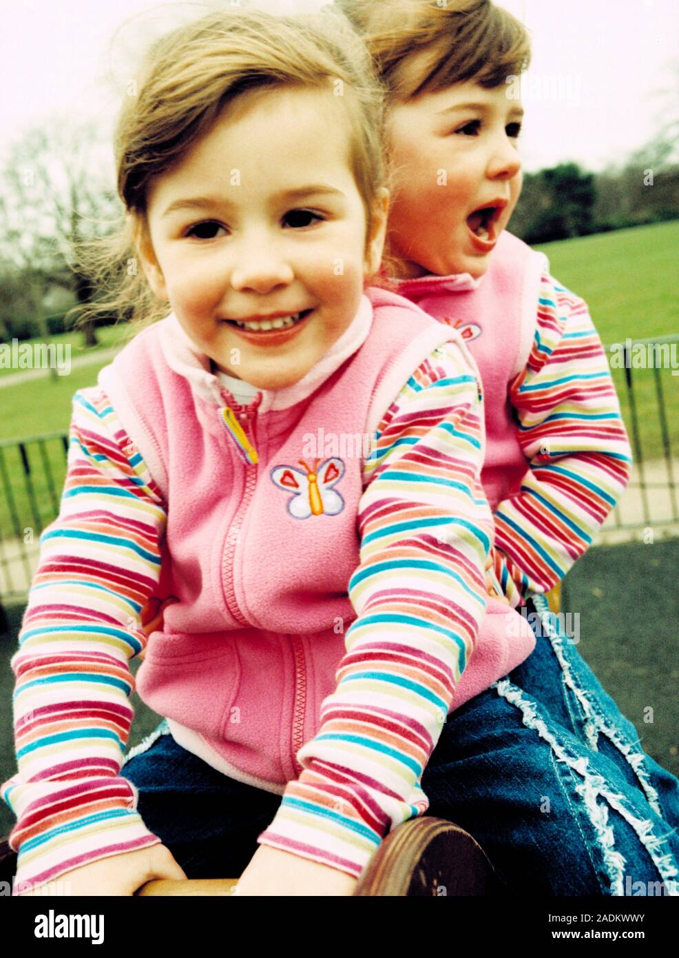 Identical 3yearold twin girls playing. identical