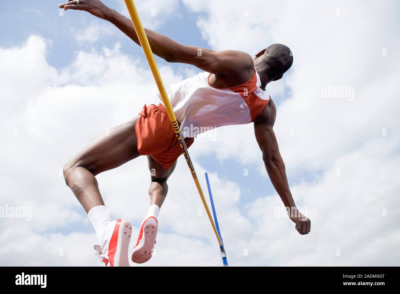 MODEL RELEASED. Athlete performing a high jump. This is a track and ...