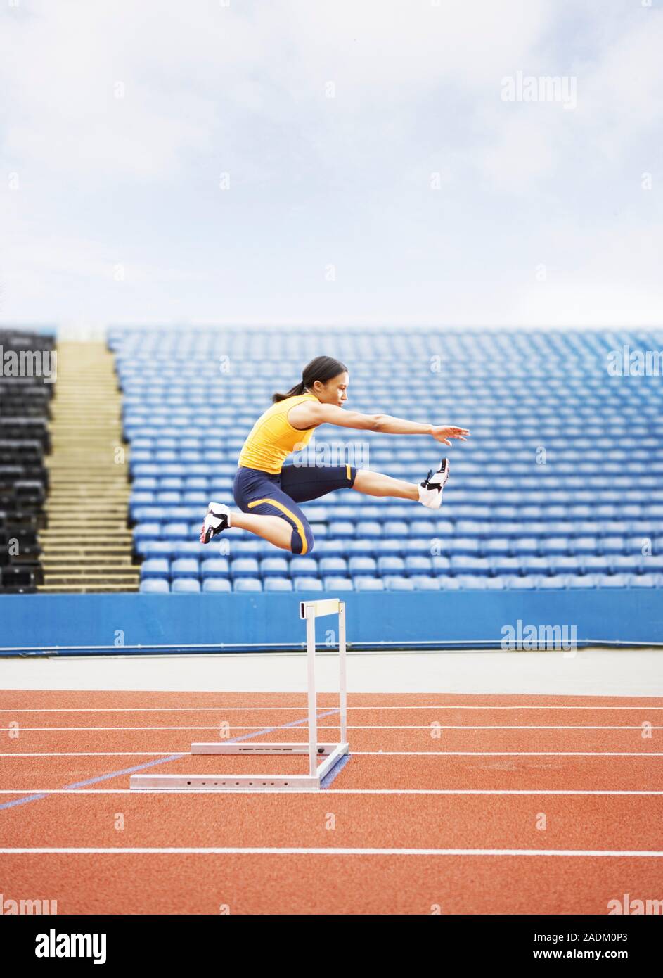 MODEL RELEASED. Airborne hurdler. Stock Photo