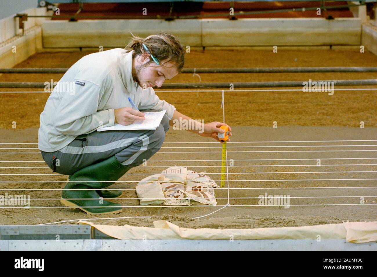 Wave tank experiment. Student conducting an experiment in a wave ...