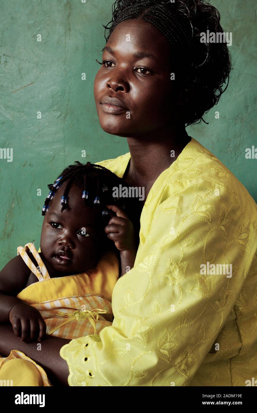 Ugandan mother and child. Ugandan woman holding her daughter, who is