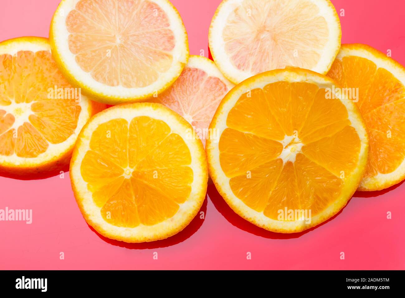 Slices of oranges and lemons, fruits full of juice with which juices