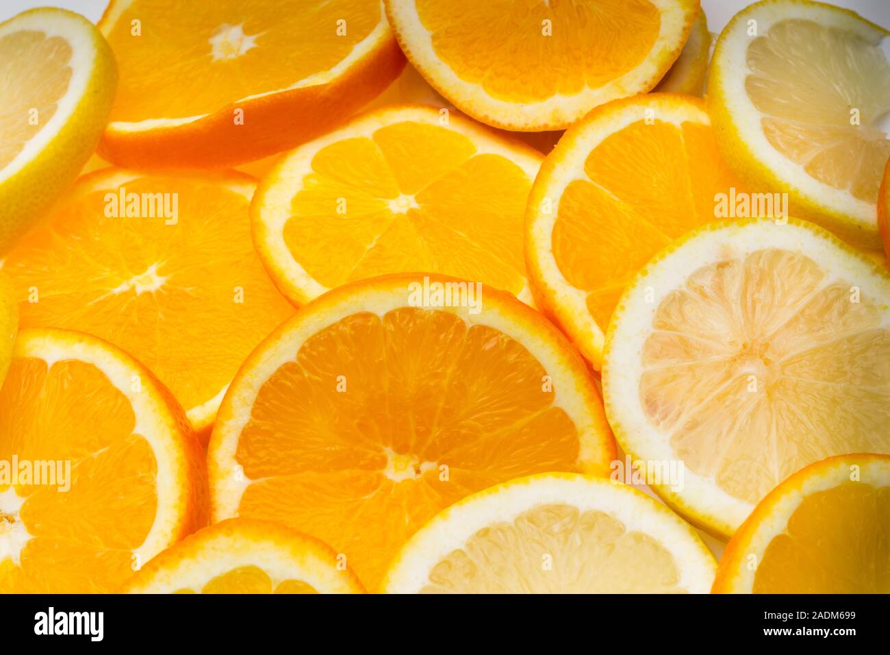 Slices of oranges and lemons, fruits full of juice with which juices