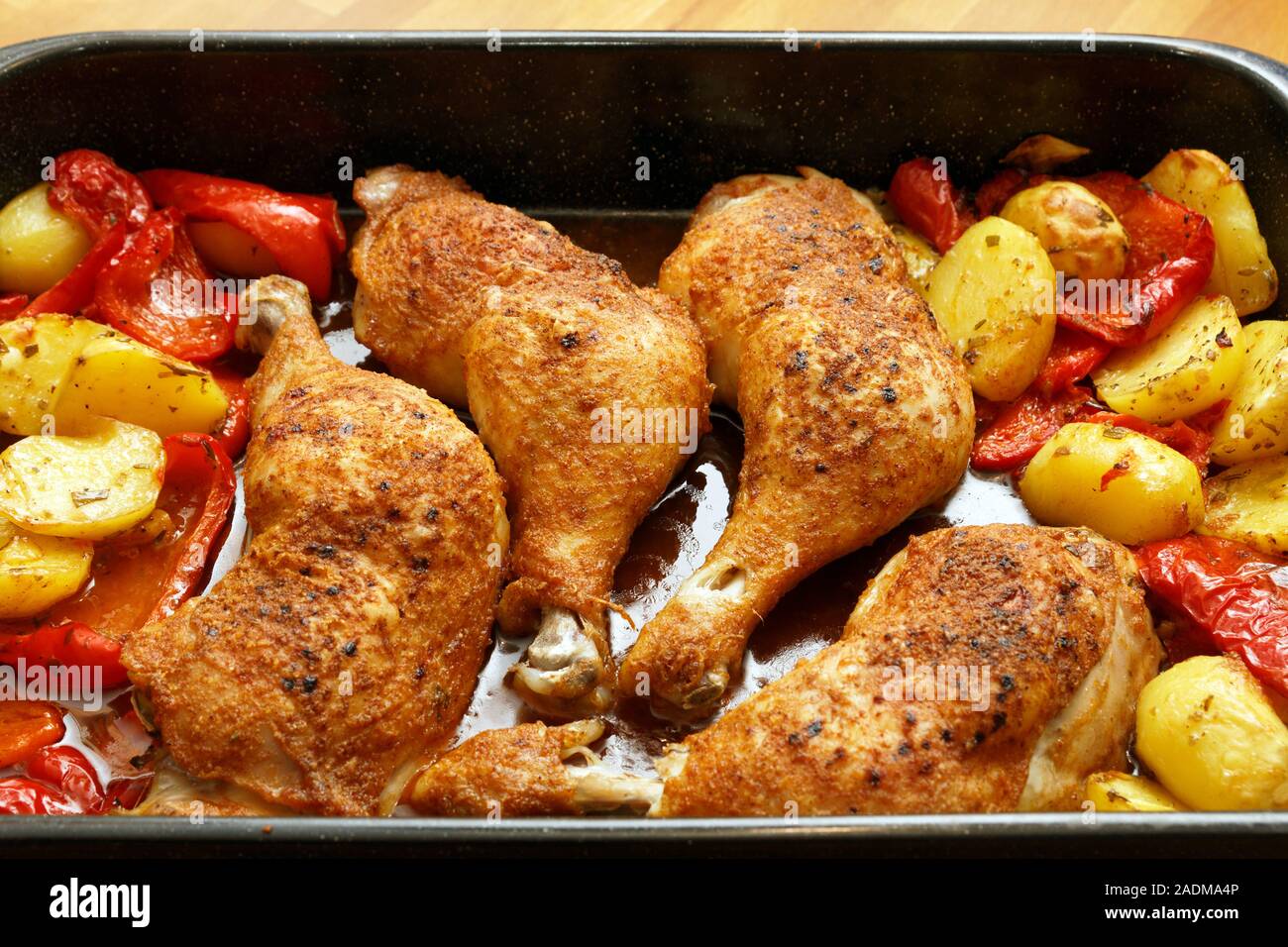 Roasted chicken drumstick with paprika and potatos Stock Photo Alamy