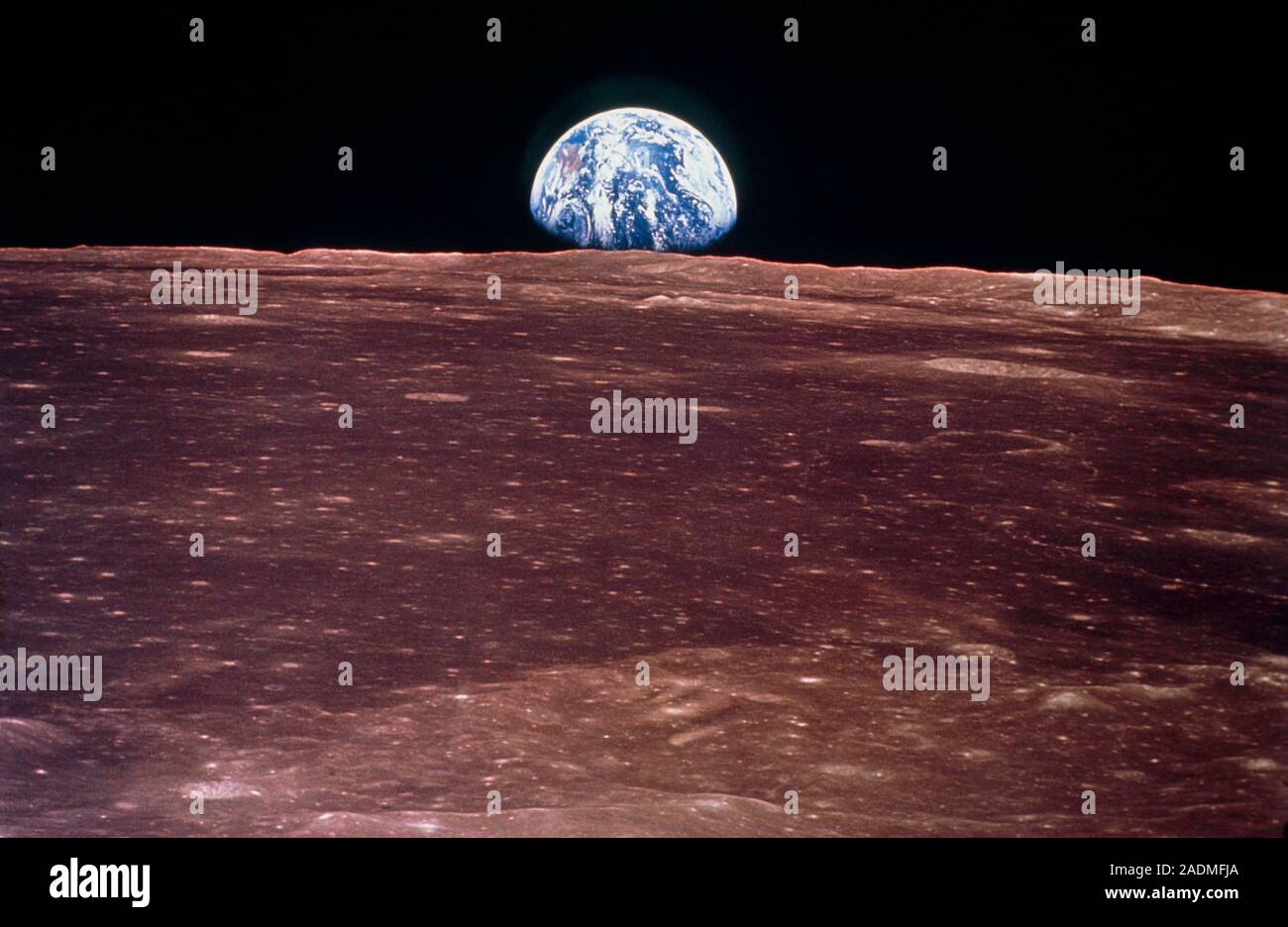 Apollo 11 view of the Earth rising over the horizon of the Moon Stock ...
