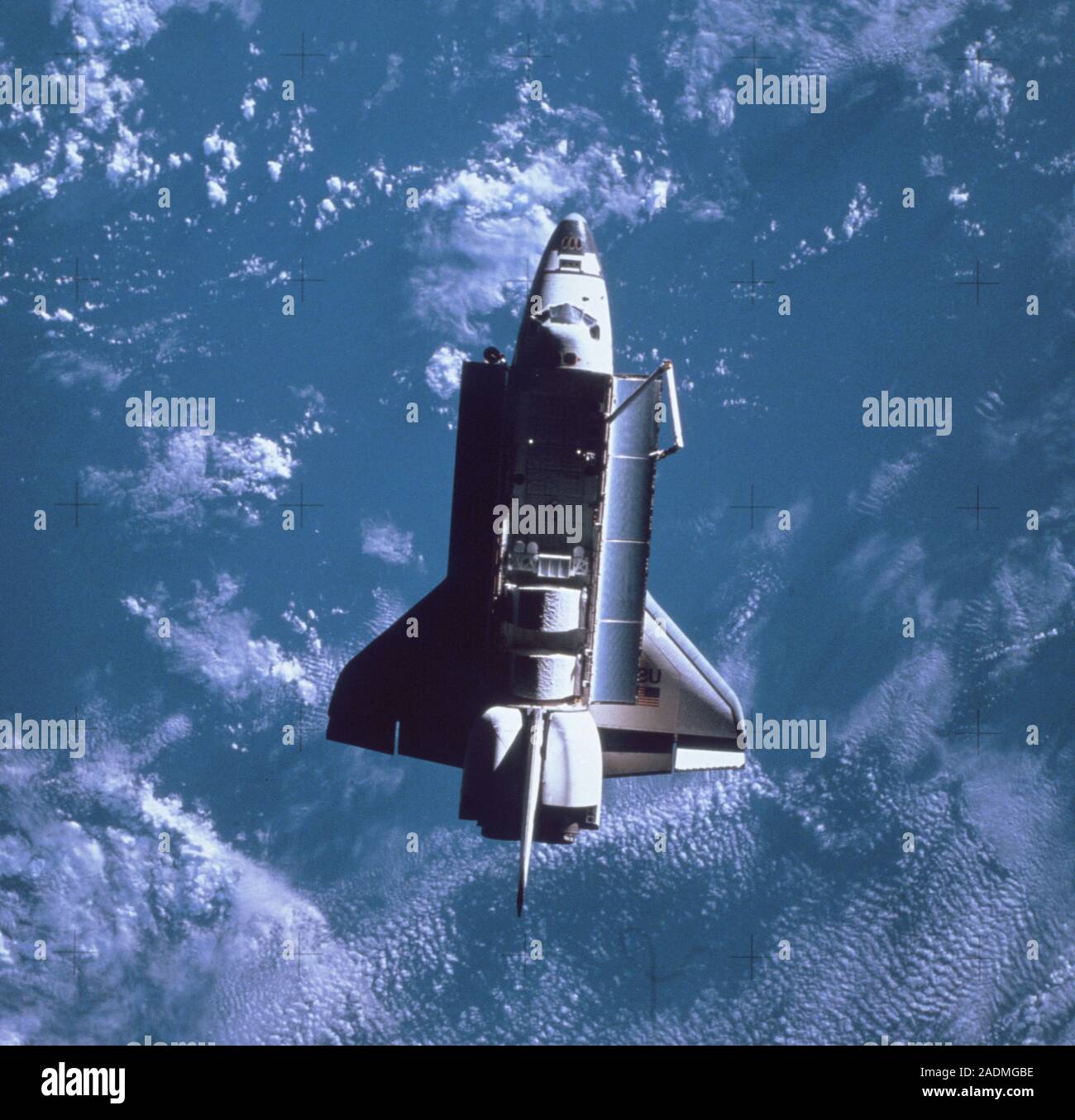 View of the space Shuttle Challenger in orbit above the Earth. The ...
