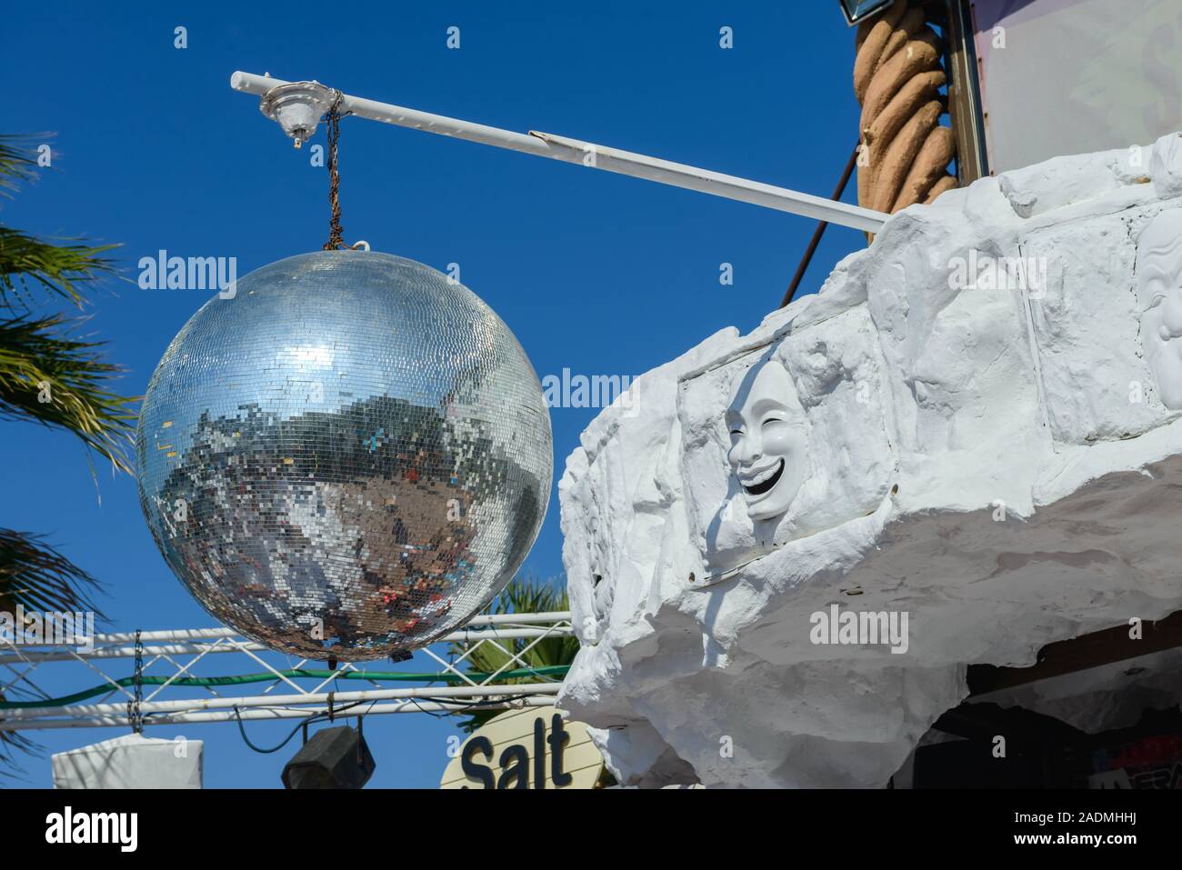 Mirror disco ball. Giant glitter ball, with the sky as a background. Disco ball in the sun.  Greece. Crete. Hersonissos. Water Park-Star Beach Stock Photo