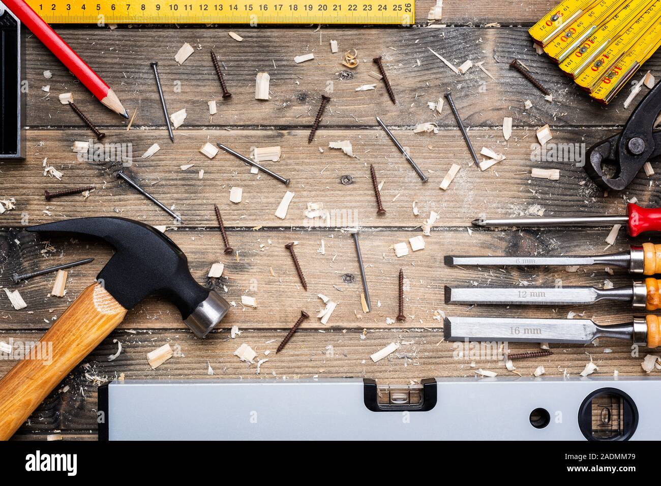 Top view of carpenter's tools on an antique wooden table. Construction