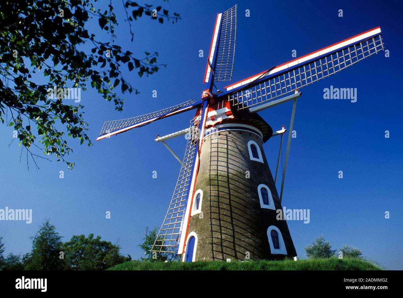 Tower windmill. This type of windmill turns its roof to face the sails to the wind. Photographed in Holland, the Netherlands. Stock Photo