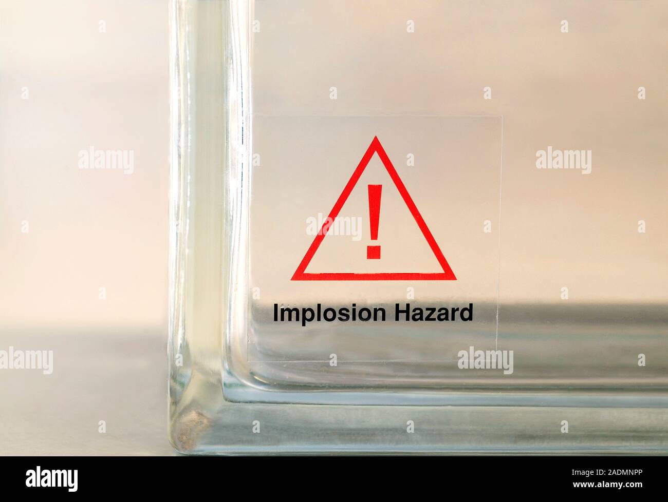 Laboratory warning label on glassware, indicating an implosion hazard