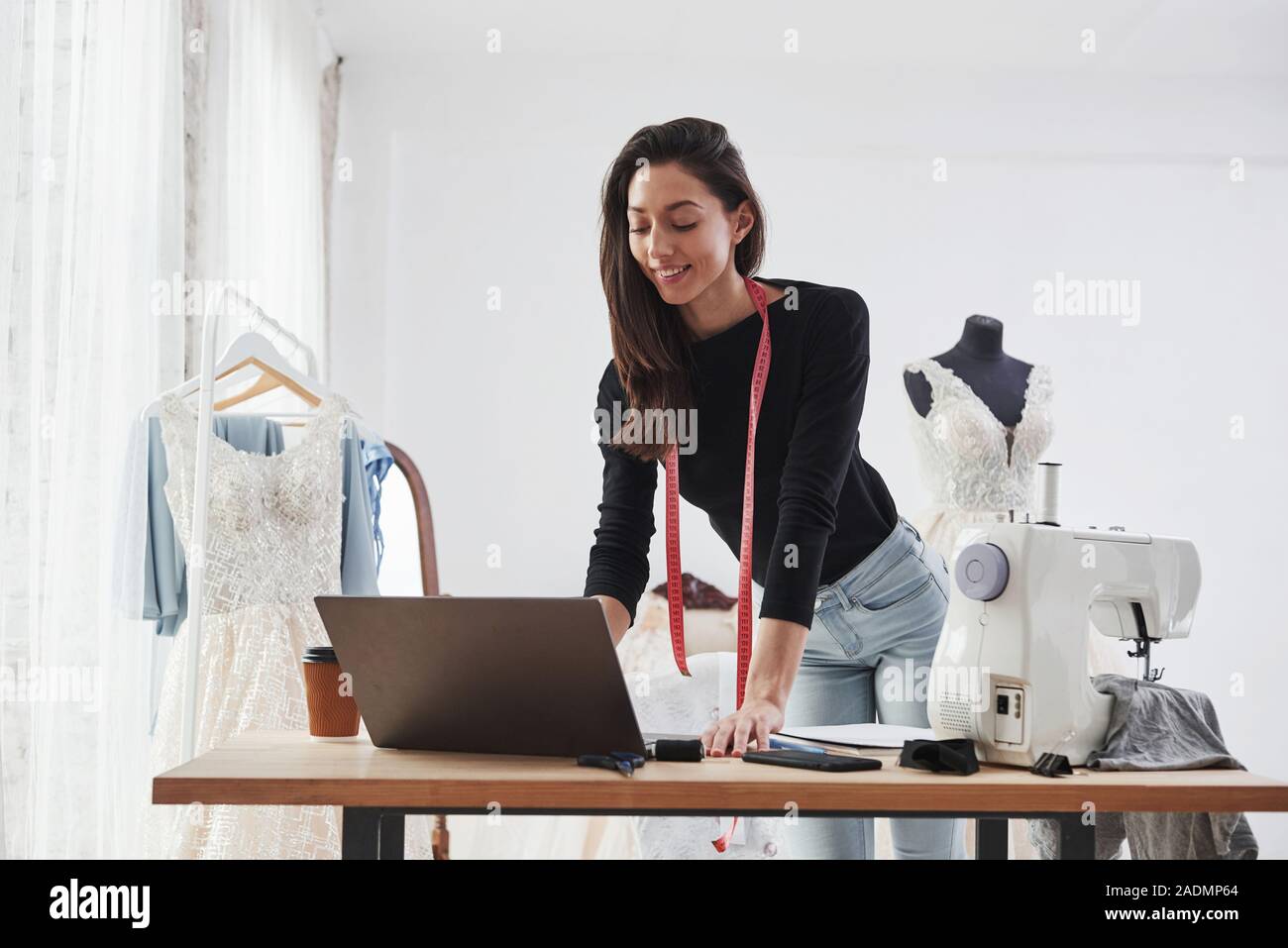 Received positive response. Female fashion designer works on the new ...