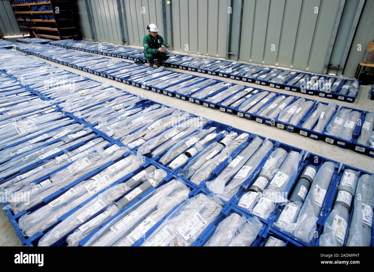 Nuclear waste disposal. Geologist examining soil cores obtained during