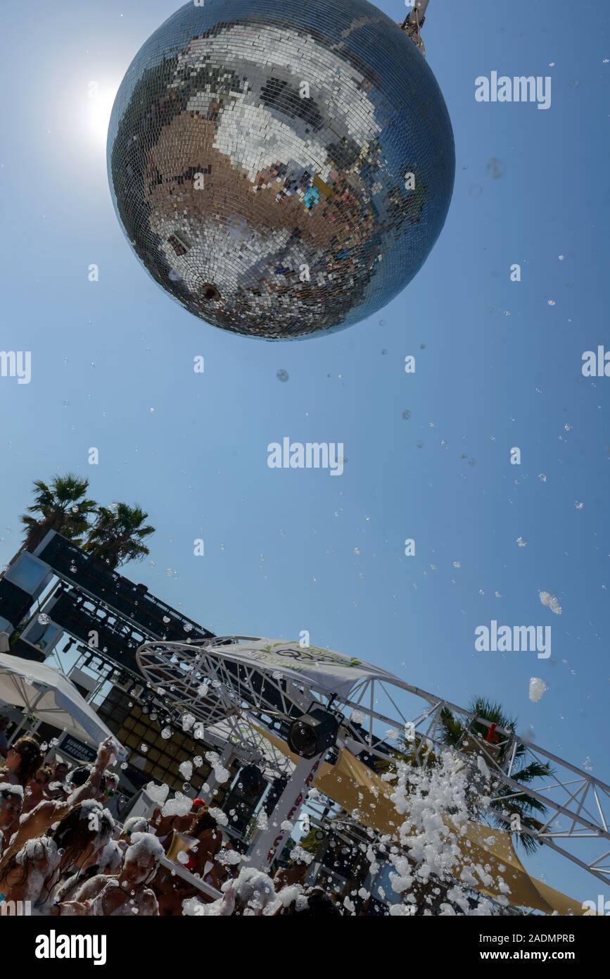 Mirror disco ball. Giant glitter ball, with the sky as a background. Disco ball in the sun.  Greece. Crete. Hersonissos. Water Park-Star Beach Stock Photo