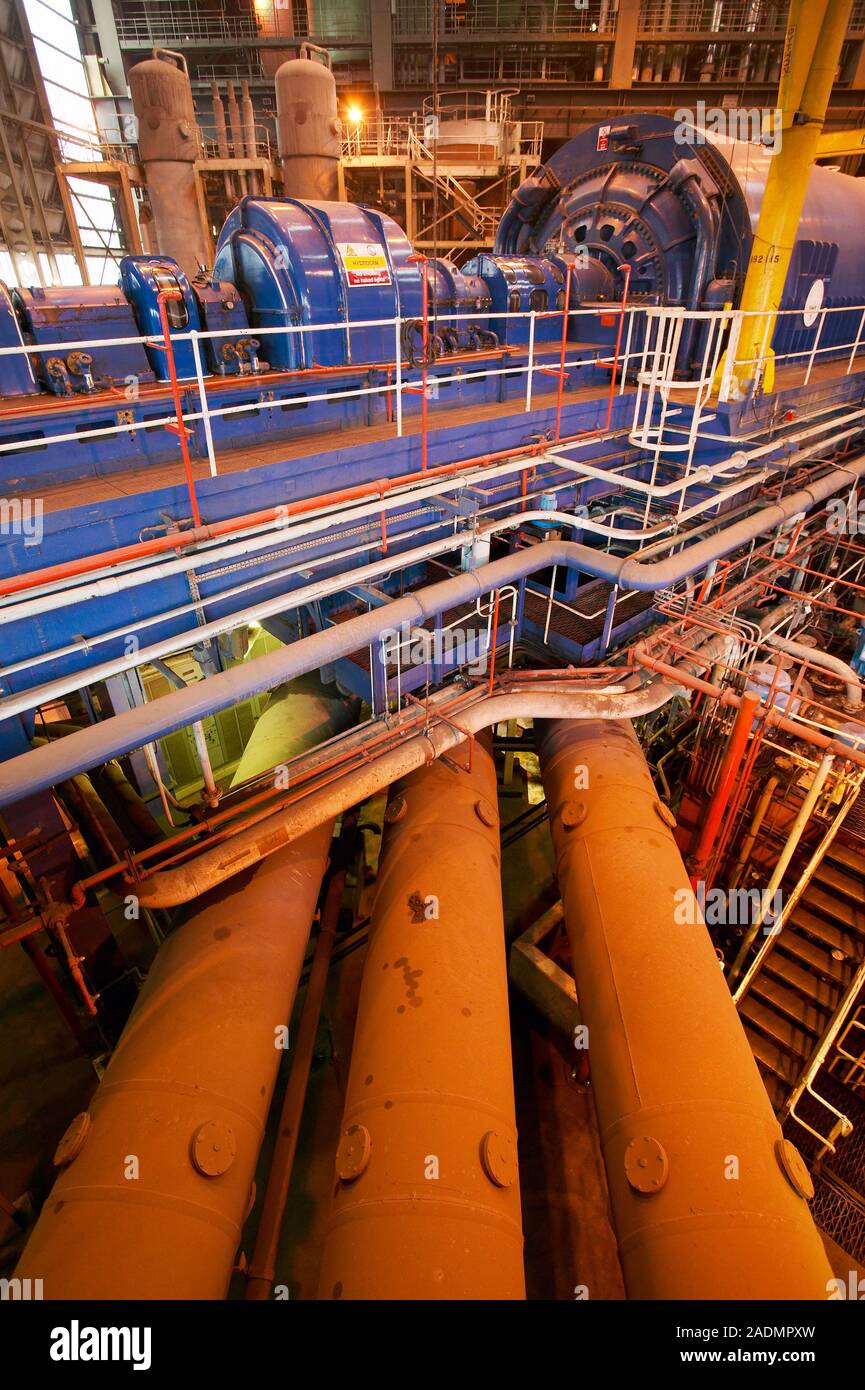 Power station turbine hall. Generator (right) and exciter (left, both