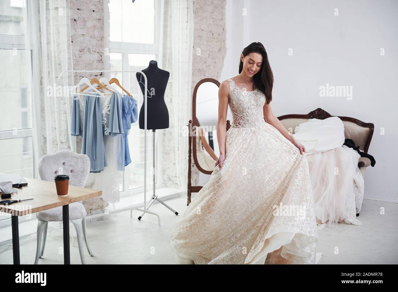 It's so long. The process of fitting the dress in the studio of hand