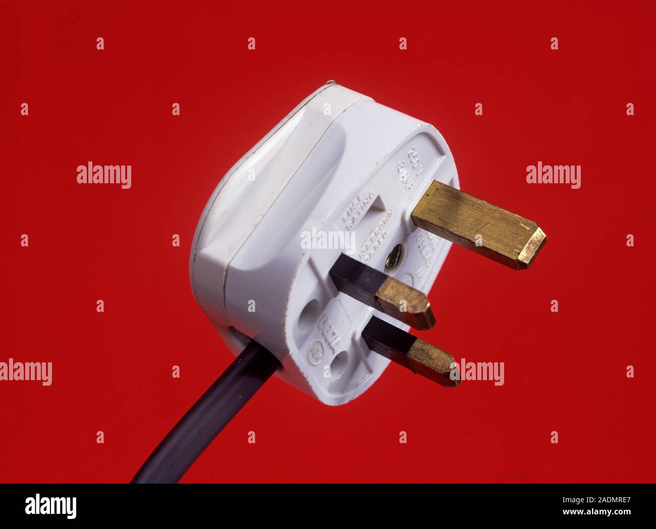 Electric plug. Threepin plug used to connect electrical appliances to mains electricity Stock