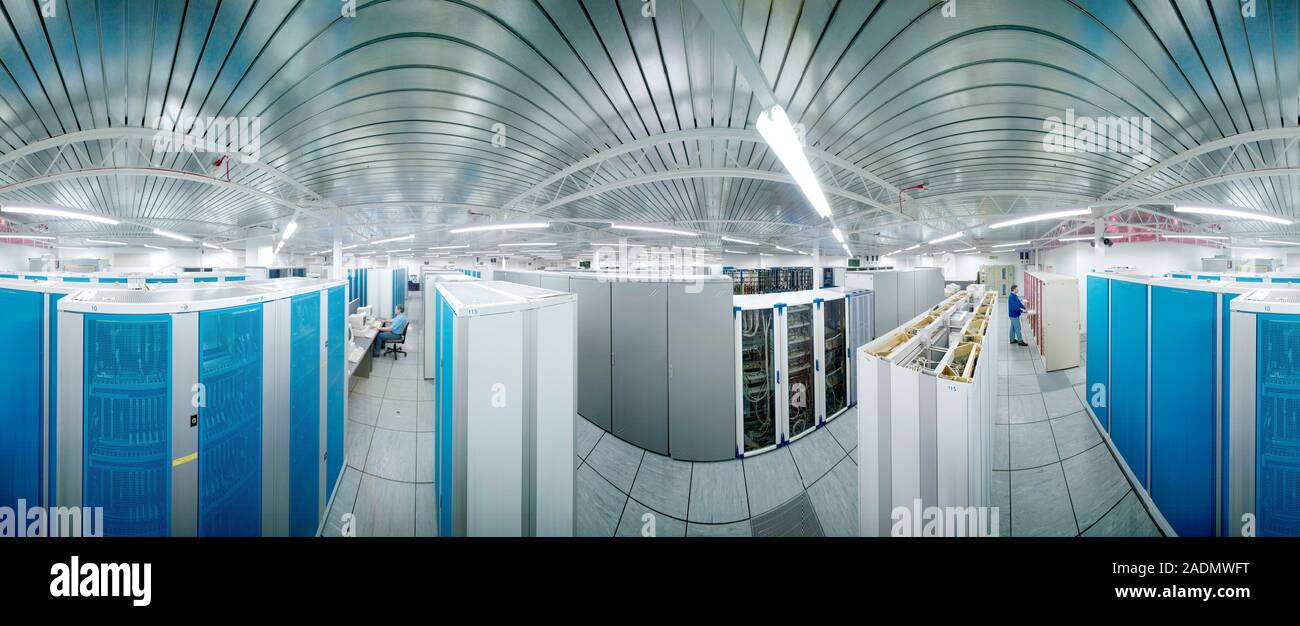 Mobile phone exchange. Technicians working in a mobile telephone network exchange centre. Stock Photo