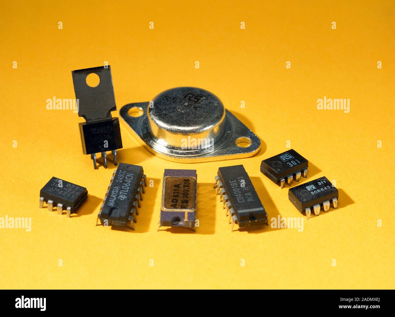 Electronic circuit board components, including microchips and a transistor (upper centre Stock