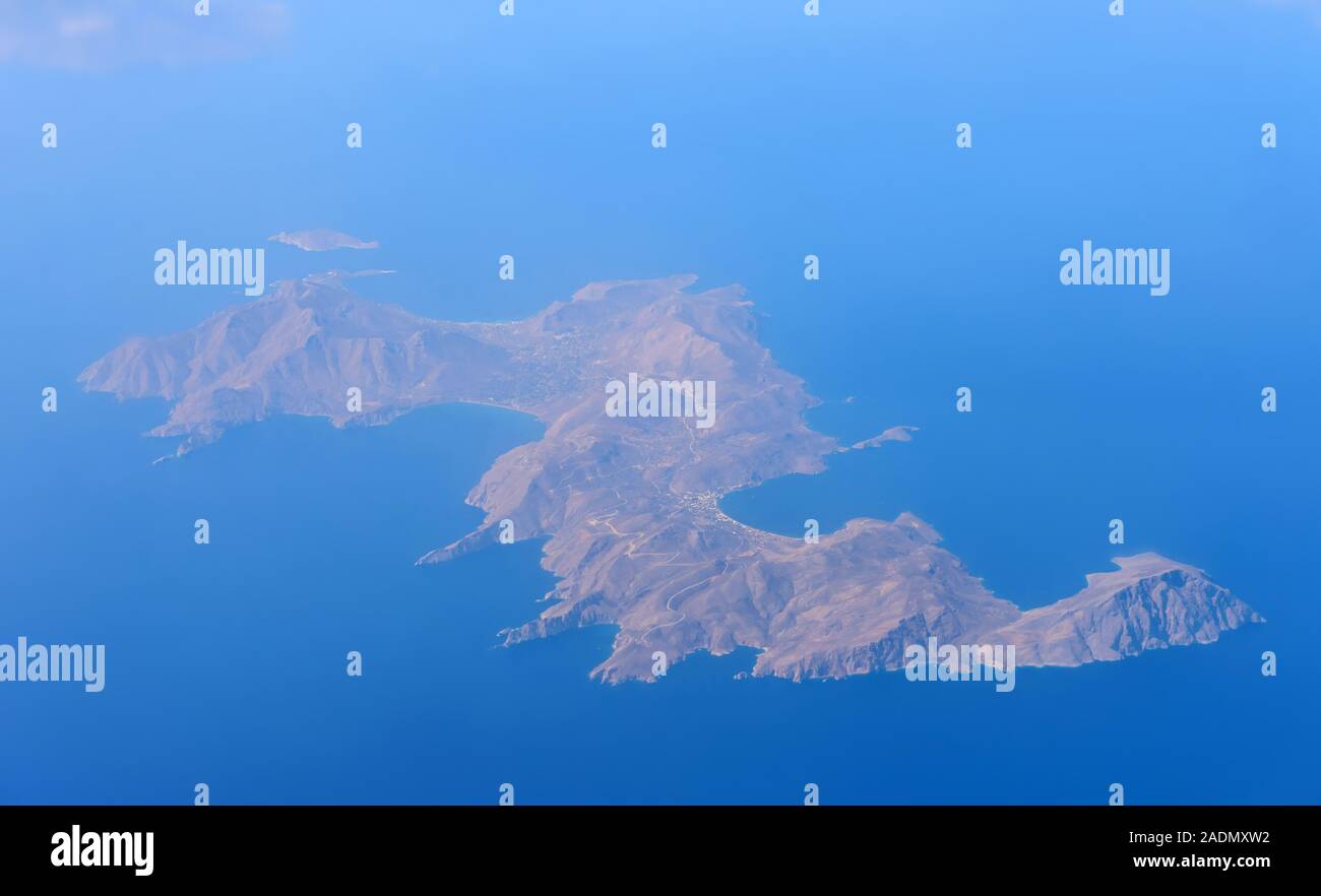 Tilos Island. The plane flies over the sea view from the window. Top view of Greece. Crete. Stock Photo