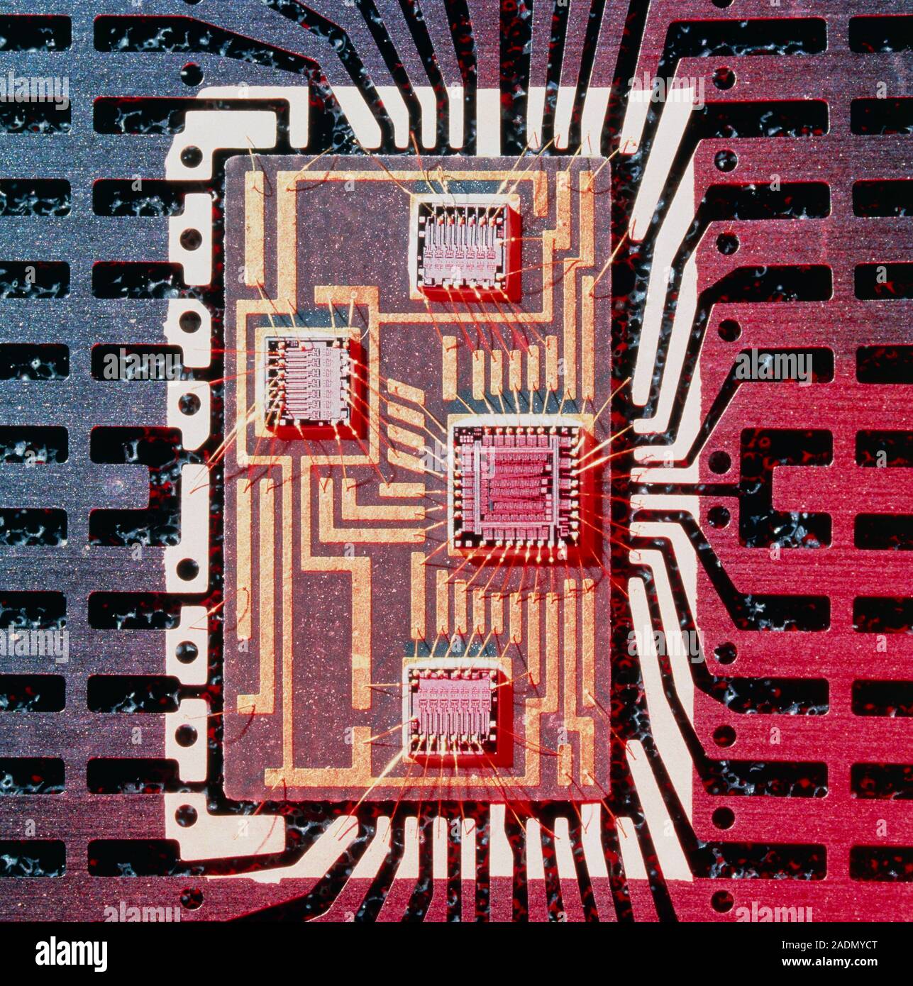 Hybrid chip. Macro photograph of a hybrid integrated circuit (IC). A hybrid IC is one where two or more small components are mounted onto a single sub Stock Photo