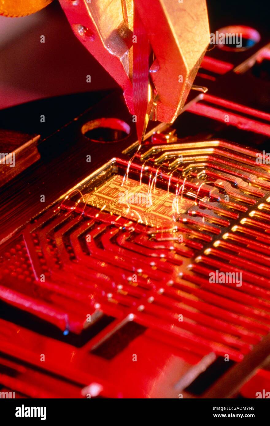 Microprocessor manufacture. A machine placing connections from a