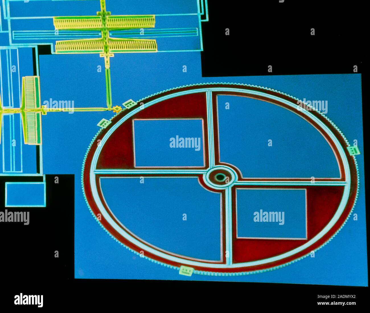 Micromotor. Coloured scanning electron micrograph of a micromotor - a ...