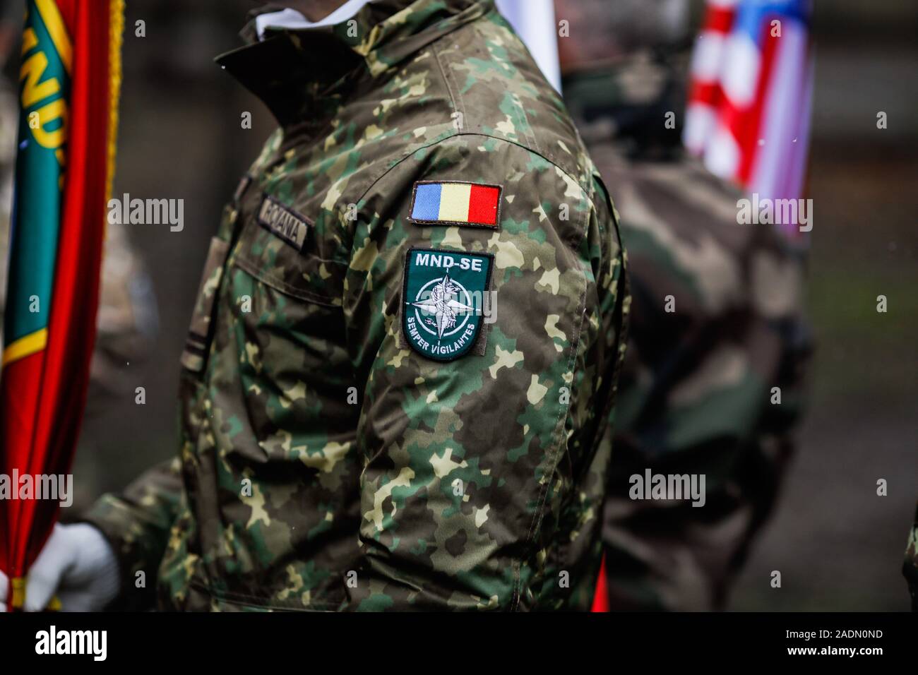 Shallow depth of field image (selective focus) with details of a Romanian soldier uniform and insignia. Stock Photo