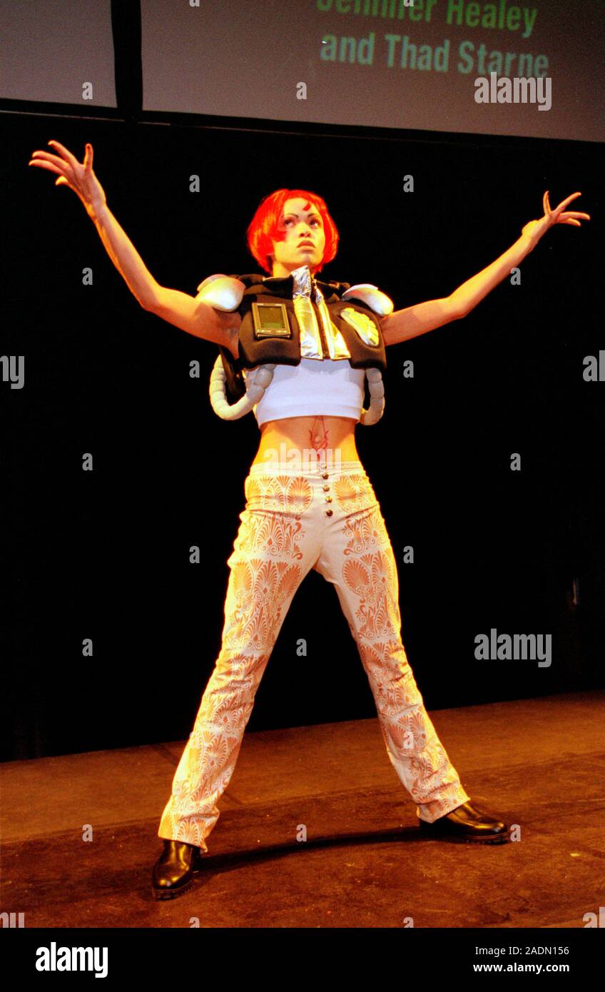 Computerised clothing. Fashion model wears compu- terised smart clothes ...