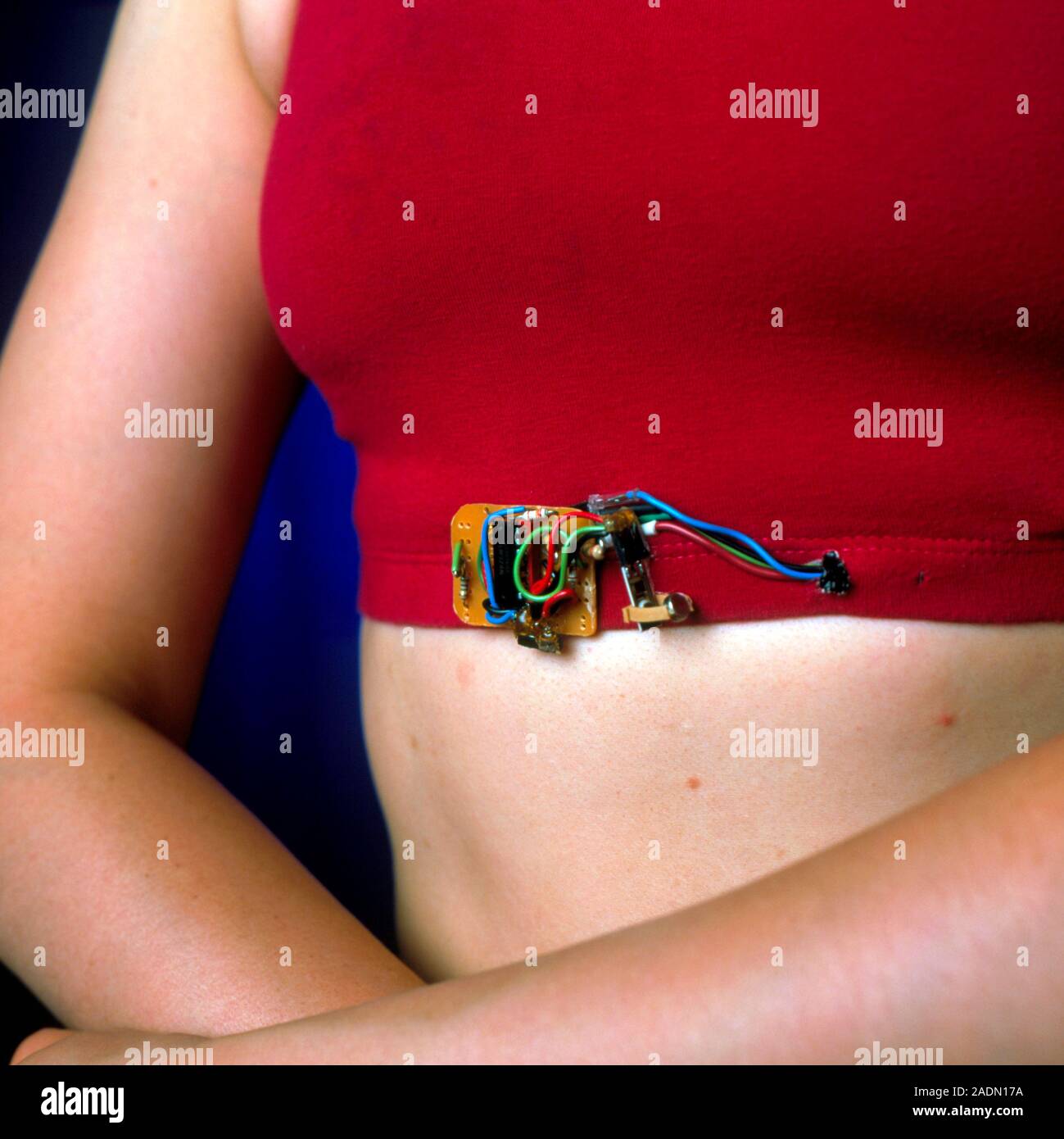 Wearable computing. Woman wearing a prototype respirationmeasuring