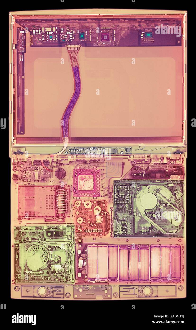 Laptop computer. Coloured X-ray of a laptop computer. The computer's screen is in upper frame (pink). Most of the components are seen in lower frame. Stock Photo