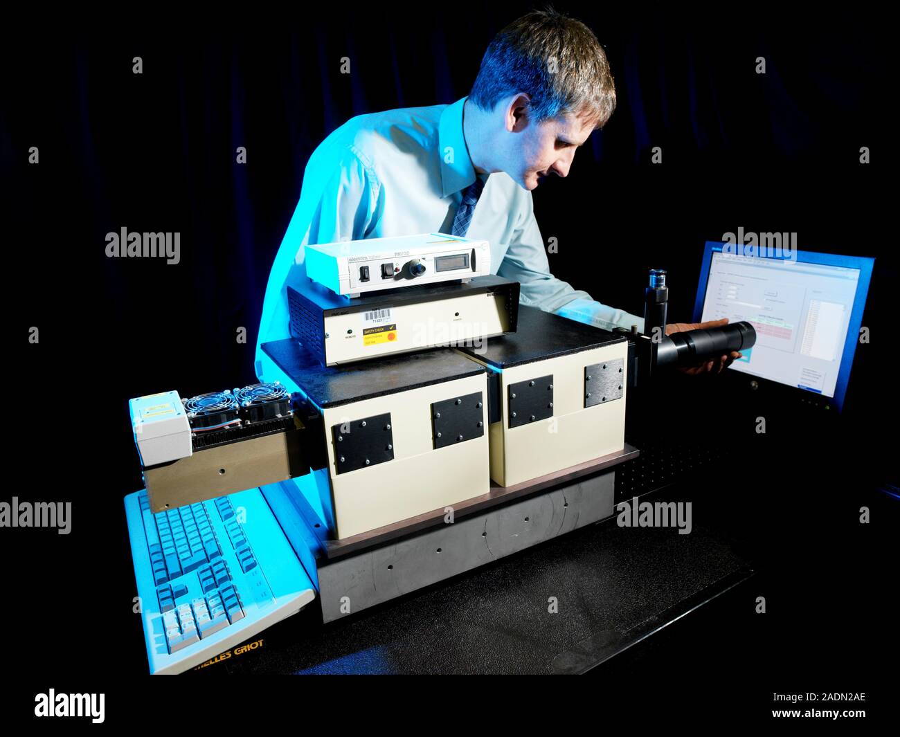 Visual display unit research. Physicist using a photon counter to ...