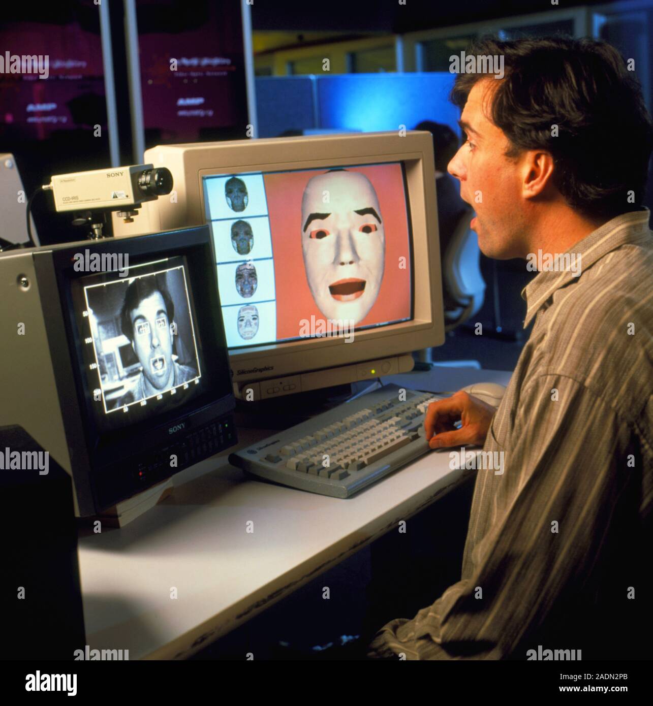 Face recognition. Scientist with a computer which recognises facial ...
