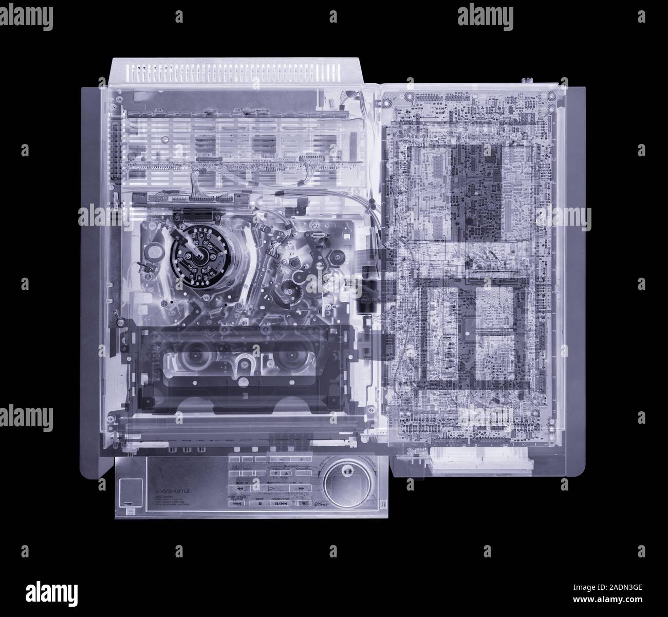 Video cassette recorder. Simulated X-ray of a video cassette recorder (VCR) seen from above. This device is used to record and playback audio- visual Stock Photo