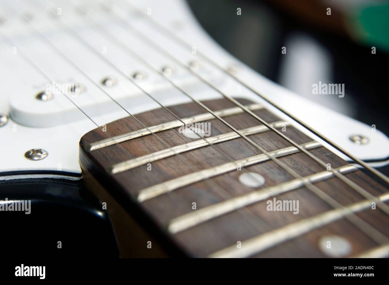 Frets on an electric guitar Stock Photo Alamy