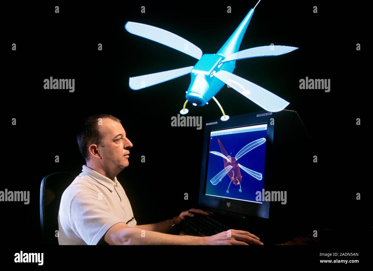Miniature unmanned aerial vehicle (UAV). Composite image of a researcher and a miniature UAV. The UAV was designed by the French defence research agen Stock Photo