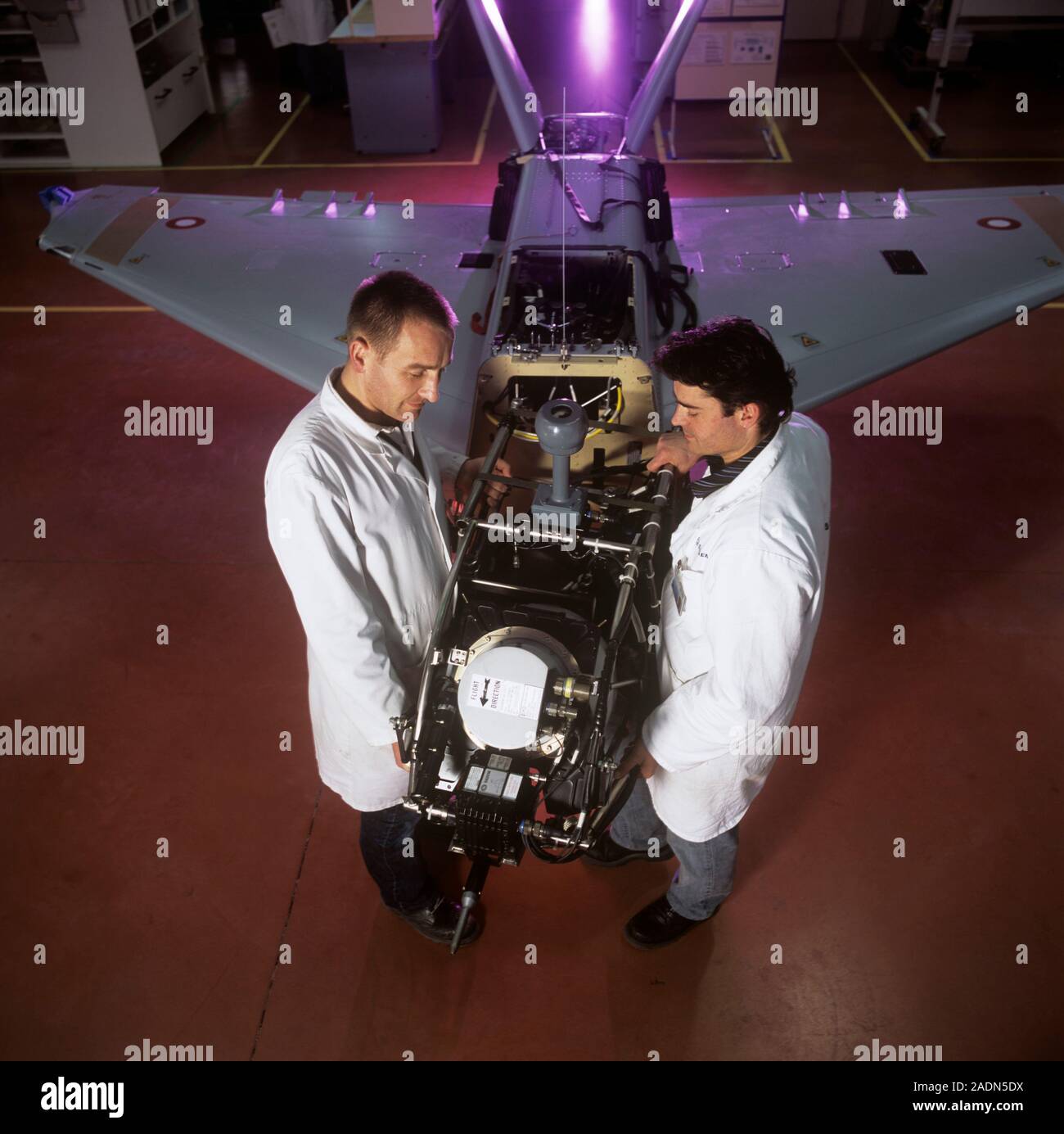 Sperwer UAV manufacture. Engineers assembling a Sperwer UAV (unmanned aerial vehicle) at a manufacturing and testing facility. UAVs, sometimes known a Stock Photo