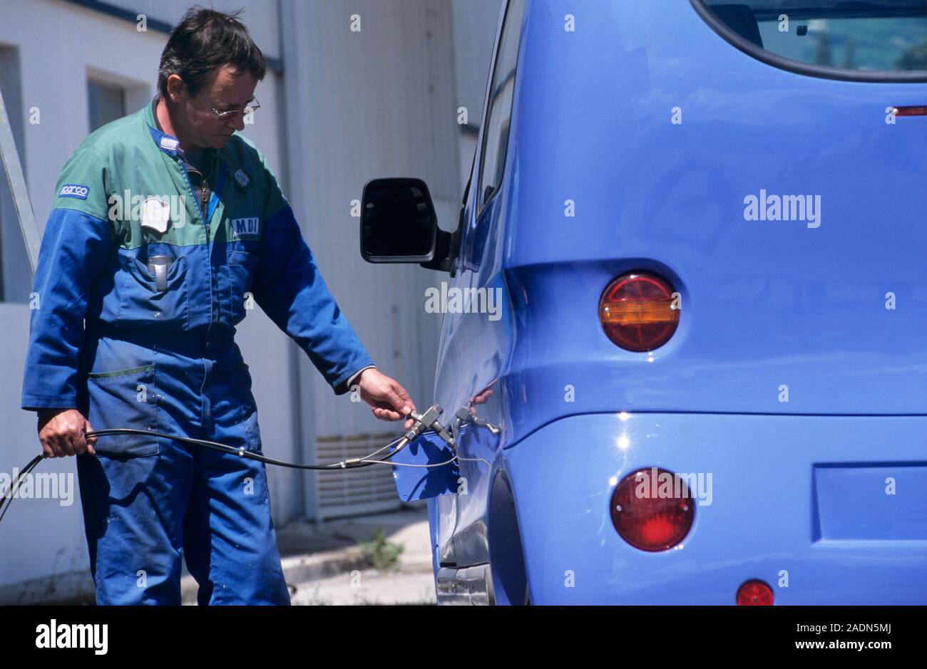 Compressed air car. Air Car being filled with compressed air. This car