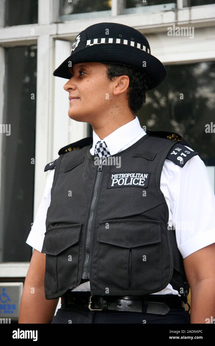 MODEL RELEASED. Policewoman wearing body armour. This type of vest is