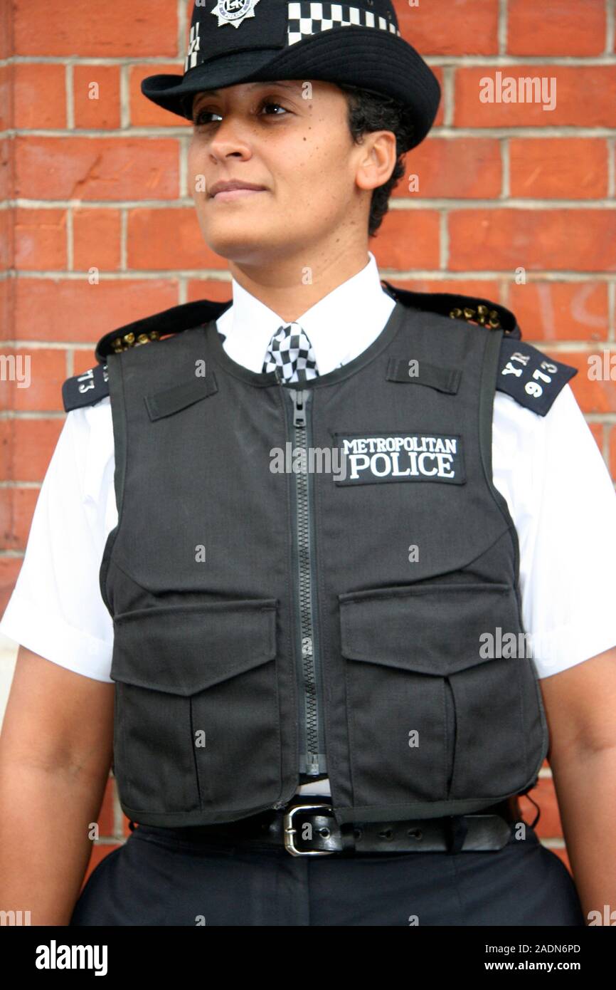 MODEL RELEASED. Policewoman wearing body armour. This type of vest is